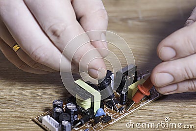 Engineer electronics. Hands close-up. Stock Photo