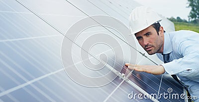 Engineer expert in solar energy photovoltaic panels with remote control performs routine actions for system monitoring using clean Stock Photo