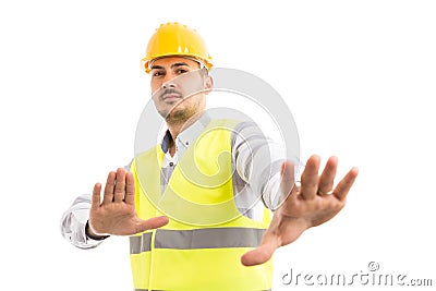 Engineer or foreman acting scared defending gesture Stock Photo