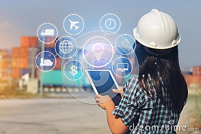 Engineer hand holding digital tablet with hologram on front cont Stock Photo