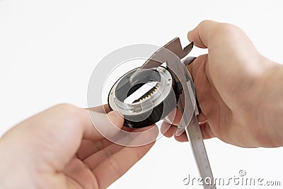 the engineer hand working and measure the parts with caliper tool Stock Photo