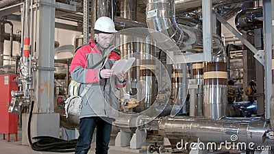 Engineer Inside Power Plant With Checklist Stock Photo