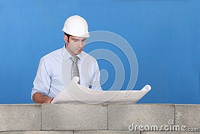 Engineer inspecting a blueprint Stock Photo