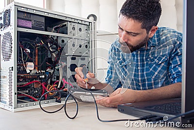 Engineer maintains a computer Stock Photo