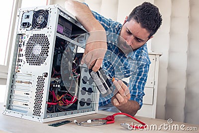 Engineer maintains a computer Stock Photo