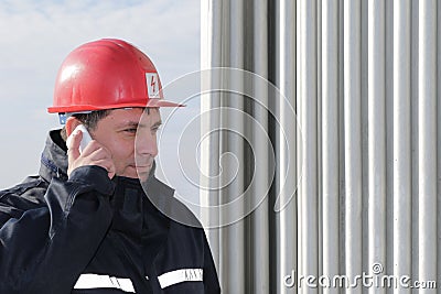 Engineer make call in power plant Stock Photo