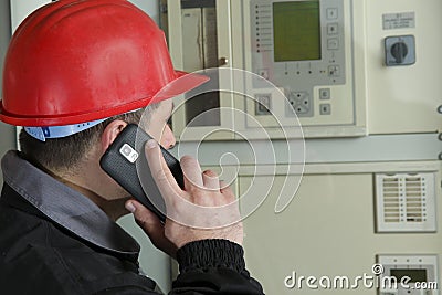 Engineer make call in power plant Stock Photo
