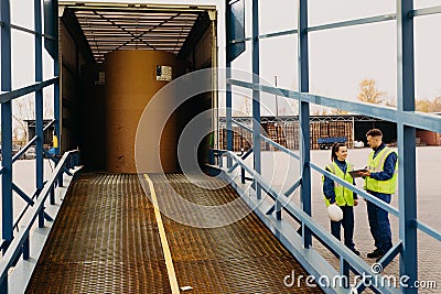 engineers control loading containers box from cargo freight ship for import export Stock Photo