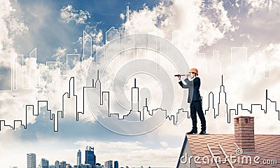 Engineer man standing on roof and looking in spyglass. Mixed med Stock Photo