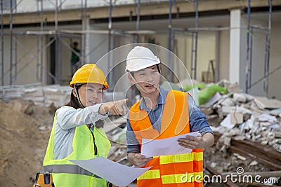 Engineer manager inspects construction sites and checking blueprints at building townhome project Stock Photo