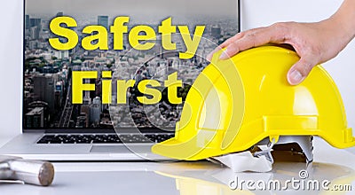 Engineer is picking up safety helmet for Safety First Stock Photo