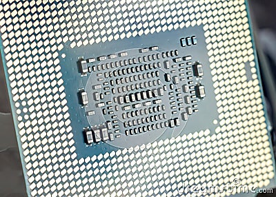 Engineer plugging CPU microprocessor to motherboard socket. Computer technology and hardware maintenance or repair Stock Photo