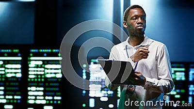 Engineer preventing cybersecurity issues Stock Photo