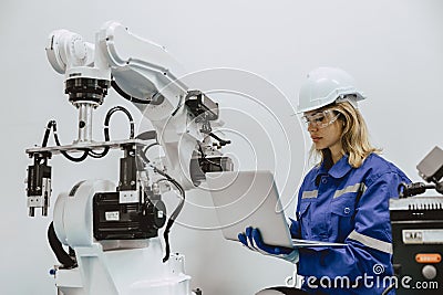 Engineer program robot machine in advance technology robotic factory industry, Service maintenance robot arm software Stock Photo