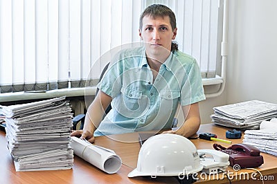 Engineer with project drawings in office Stock Photo