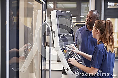 Engineer Showing Apprentice How To Use CNC Tool Making Machine Editorial Stock Photo