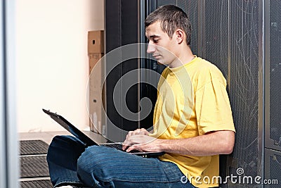 The engineer sits front at equipment Stock Photo