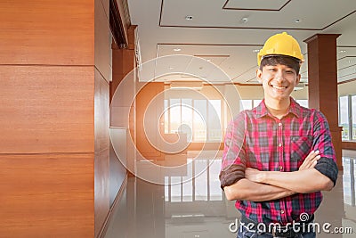 Engineer smile and arms crossed in decorate Interior room completed. concept construction background Stock Photo