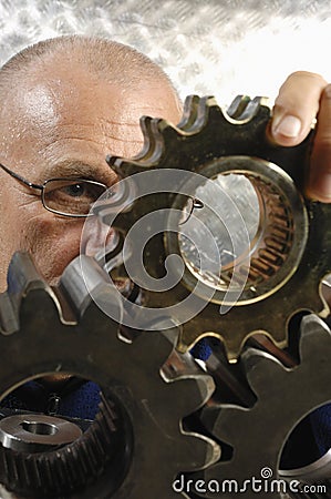 Engineer studying a gear machinery Stock Photo