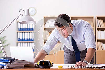 The engineer supervisor working on drawings in the office Stock Photo