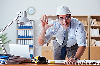 The engineer supervisor working on drawings in the office Stock Photo