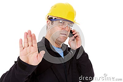 engineer talking on the phone and make the stop sign Stock Photo