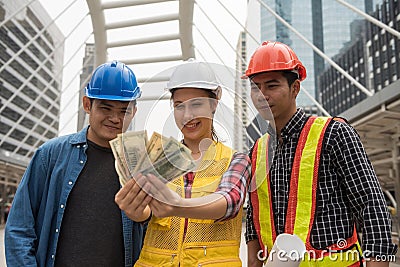 engineer team look at extra bonus money Stock Photo