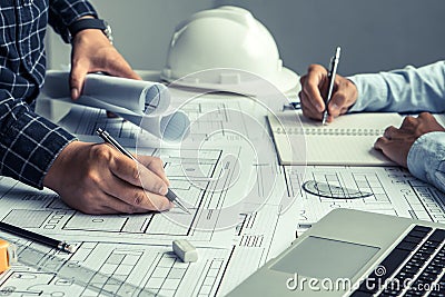 engineer team working in office with blue prints.Team of architects people Stock Photo
