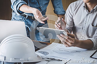 Engineer Teamwork Meeting, Drawing working on blueprint meeting for project working with partner on model building and engineering Stock Photo