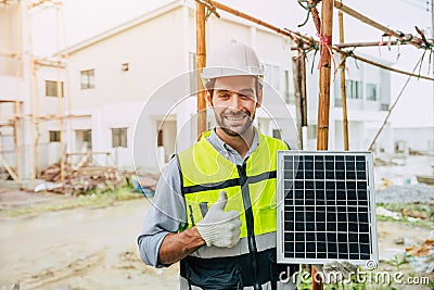 Engineer thumbs up happy with Solar panel for saving energy recommend for modern home construction Stock Photo