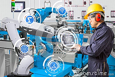 Engineer using laptop computer for maintenance automatic robotic Stock Photo