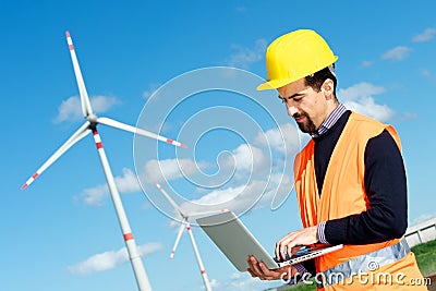 Engineer in Wind Turbine Power Generator Station Stock Photo