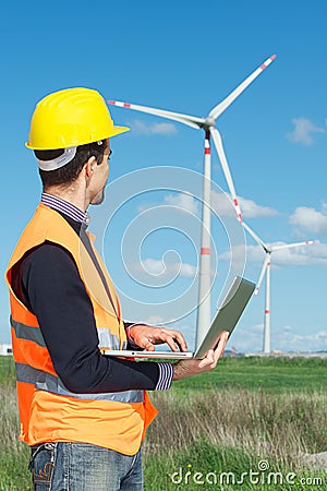 Engineer in Wind Turbine Power Generator Station Stock Photo