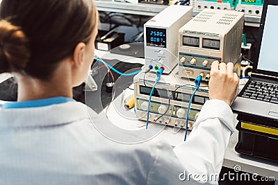 Engineer woman in electronics lab testing EMC compliance Stock Photo