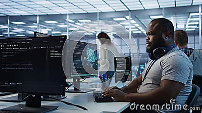 Engineer tasked with monitoring data center supercomputers Stock Photo