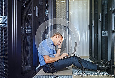 IT Engineer working on a laptop Stock Photo