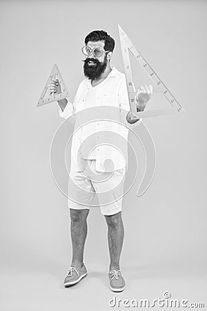 Engineering architecture faculty student. Smart student. College university education. Bearded nerd with triangle Stock Photo