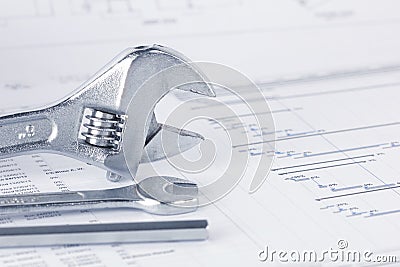 Engineering project drawing documents with wrench Stock Photo