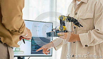 engineering robot technology with asian programmer innovation and research teamwork in coding development Stock Photo