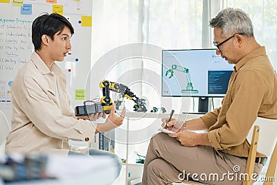 engineering robot technology with asian programmer innovation and research teamwork in coding development Stock Photo
