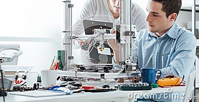 Engineering students using a 3D printer Stock Photo