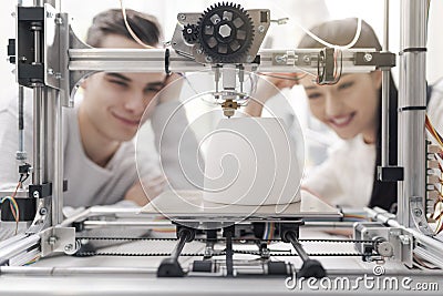 Engineering students using a 3D printer in the lab Stock Photo