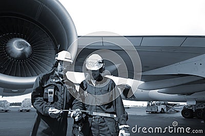 Engineers and airliner Stock Photo