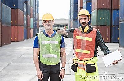 Engineers control containers loading at site Stock Photo