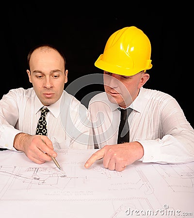 Engineers Discussing Plan Stock Photo