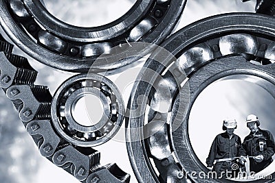 Engineers with giant ball-bearings Stock Photo