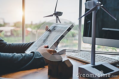Engineers hold solar panels sample for testing efficiency of solar cell panels type in office. Learn design and calculation to Stock Photo