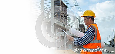 Engineers holding blueprint project working outdoors building side with blueprints on a worksite, Engineering and architecture Stock Photo