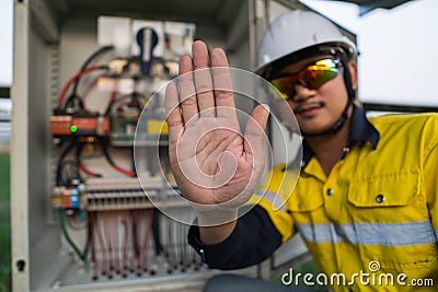 Engineers lifted their hands to show signs that do not enter in to the dangerous area Stock Photo