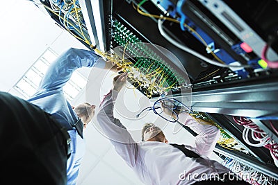 It engineers in network server room Stock Photo